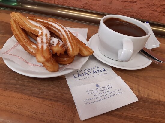 Churrería Laietana signature dishes Churros con ChocolatePorras (thicker churros)Caffè con LecheFlan